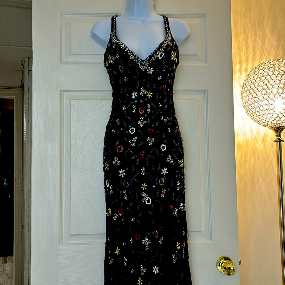 Promdress worn once . Beautiful beading and sequins thru out altered to fit 5’2